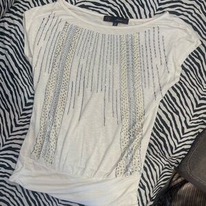 women’s top with gold and silver details